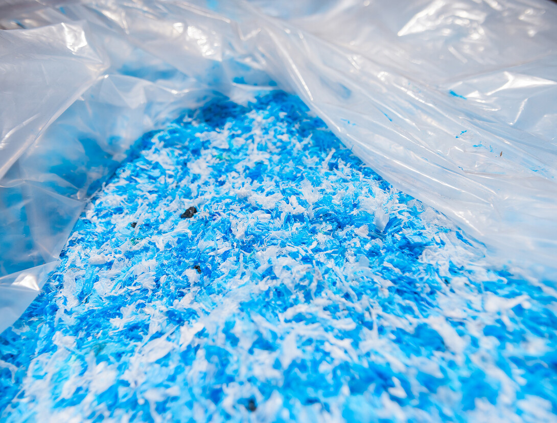 Large piles of shredded plasted bags await being turned into asphalt.