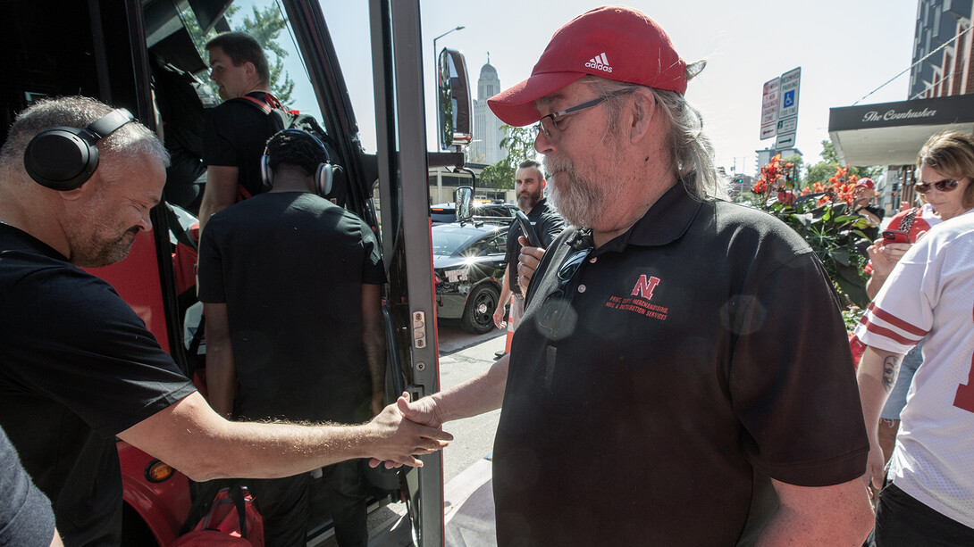 Mike Case shakes Coach Matt Rhule's hand as he boards the bus prior to the Oct. 4 homecoming game against Michigan State.