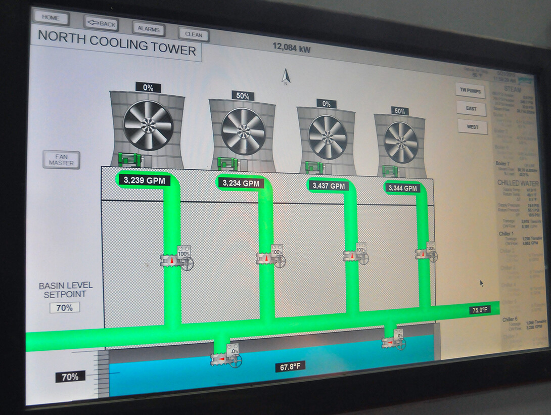 Computer screens inside the City Campus utility plant show how cooling towers (pictured) and other parts of the campus HVAC system are operating. The new tower design features four cells (represented by each fan) and allows for parts of the tower to be shutdown for repairs.