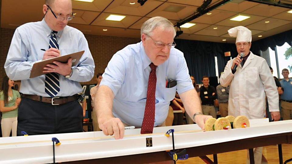 Race officials measure the distance covered by an entry in a previous Incredible, Edible Vehicle Competition. The annual engineering event is 2 to 4 p.m. Dec. 9 in the East Union.