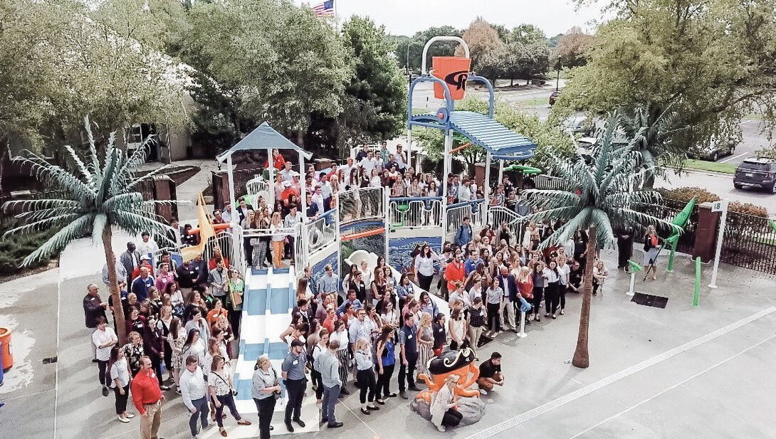 HRTM and PGA students gather in front of the Champion's Run splash pad