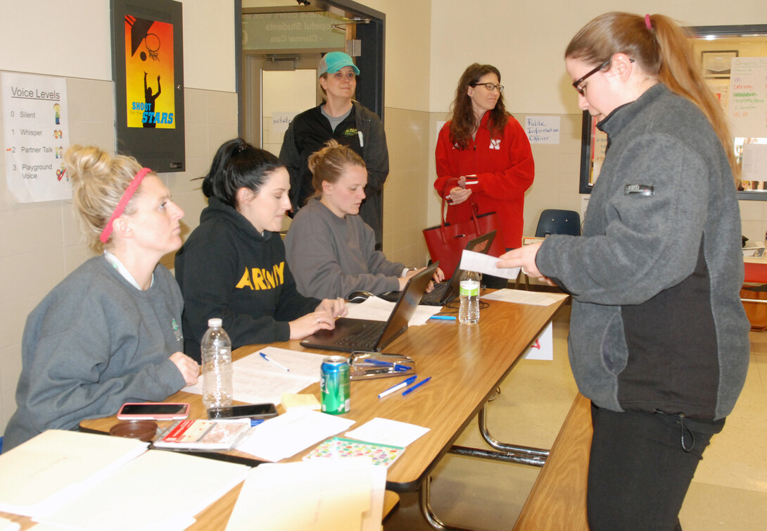 Volunteers assist flood victims at Fremont's Clarmar Elementary School. Extension Educator Ashley Mueller helped organize the flood response in Fremont.