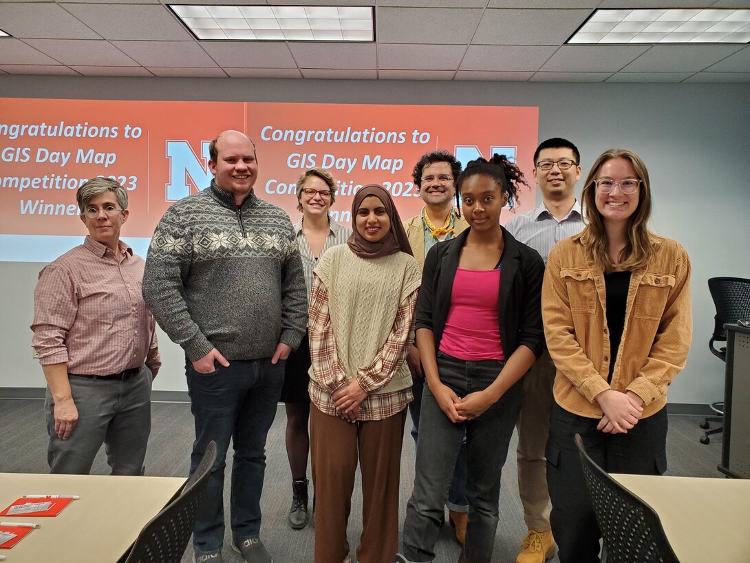 Winners of the GIS Map Competition come together with the judges of the competition to receive their awards.