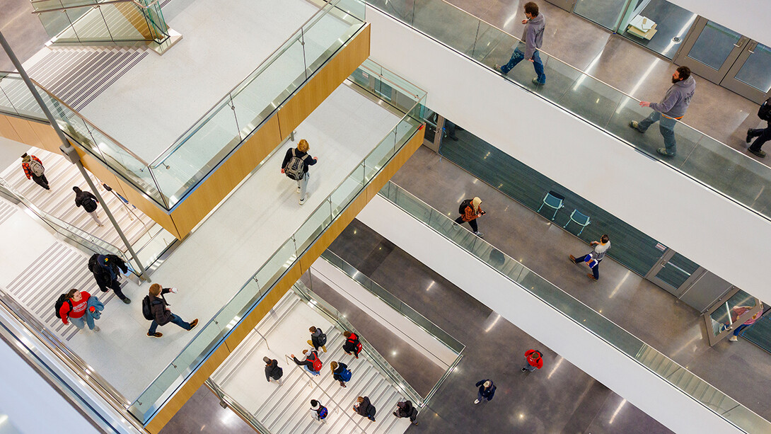 Students walk the halls and ascend the stairs of the newly opened Kiewit Hall