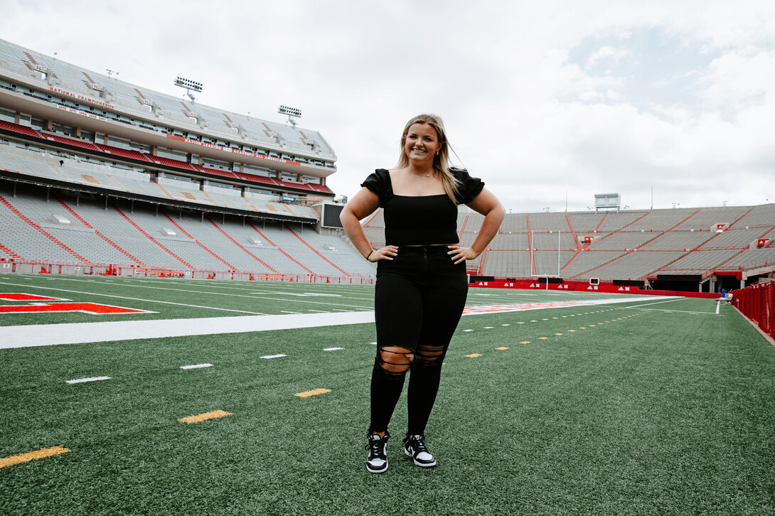 Gross on the field of Memorial Stadium. As a first-year sports media and communication major and intern with Husker Athletics, Meg is already garnering hands-on experience covering a variety of Husker sporting events.  