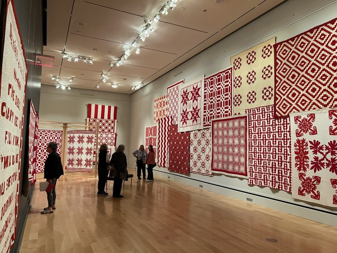 Wall of Joanna S. Rose's Red and White quilts