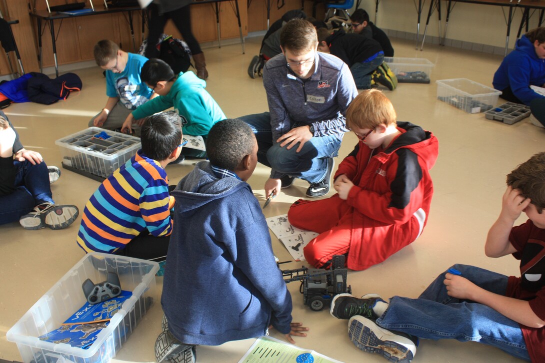 Nebraska student Colton Harper mentors students at Culler Middle School as part of a robotics club formed in January.