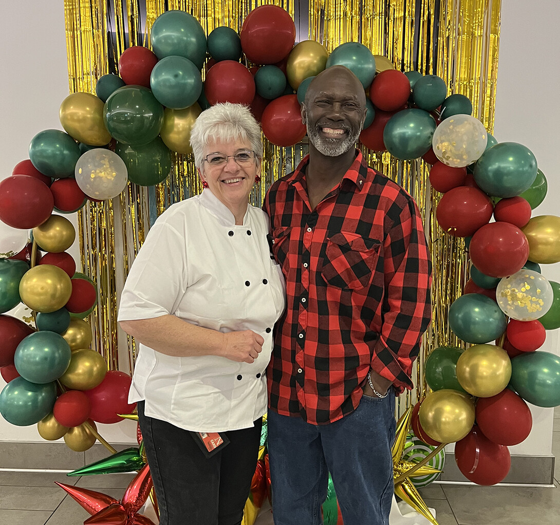 Lory Erving poses with a friend during an event at the Cather Dining Center.