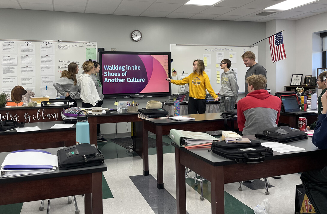 Students give a presentation on their "Walking in Another Culture's Shoes" project