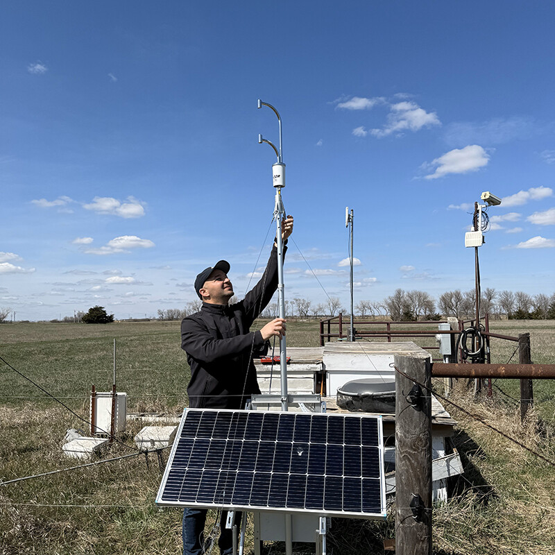 Makki Khorchani installs an Evapotranspiration sensor Licor-710 in a Nebraska pasture.