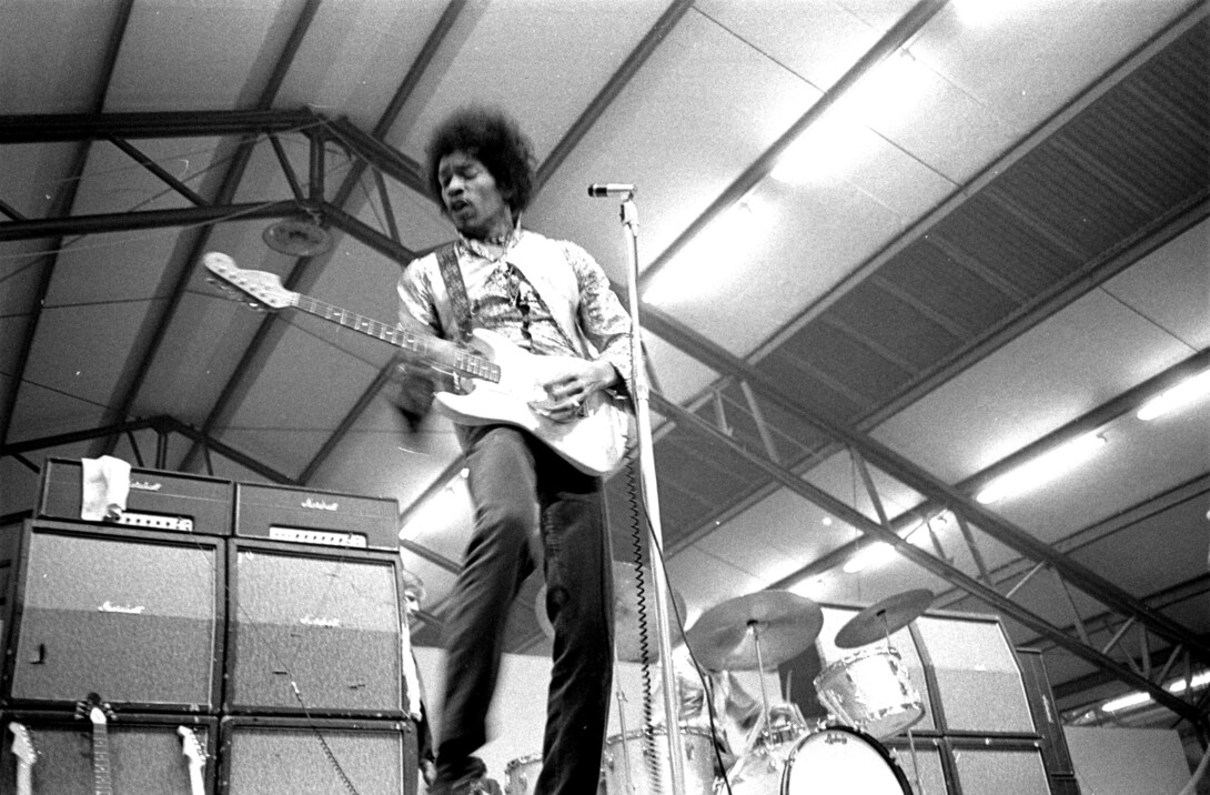 Jimi Hendrix performs on stage in 1967.