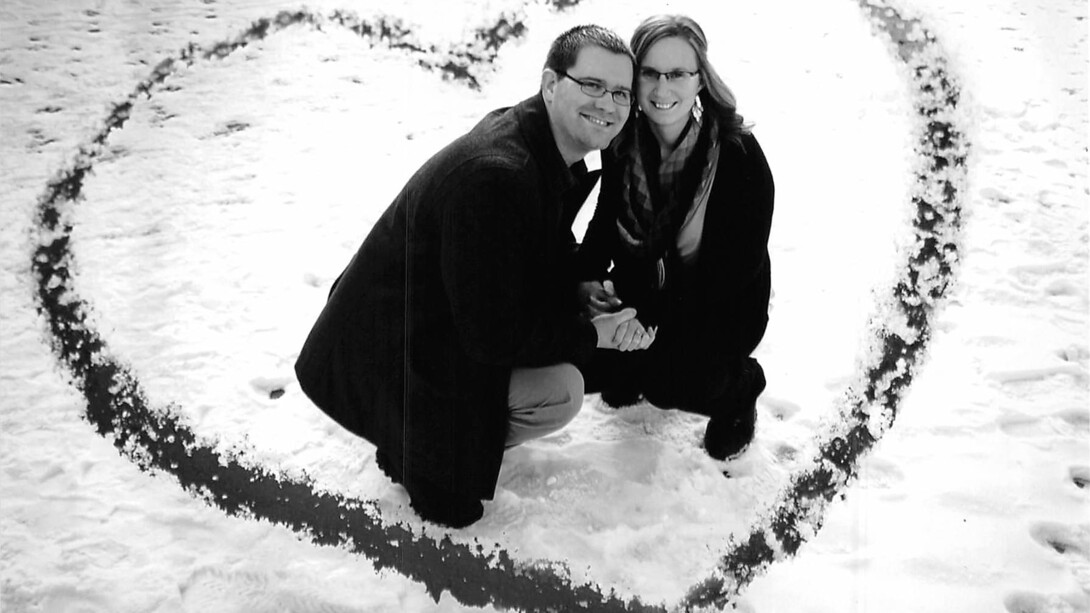 Britany Porter poses with her husband for an engagement photo.