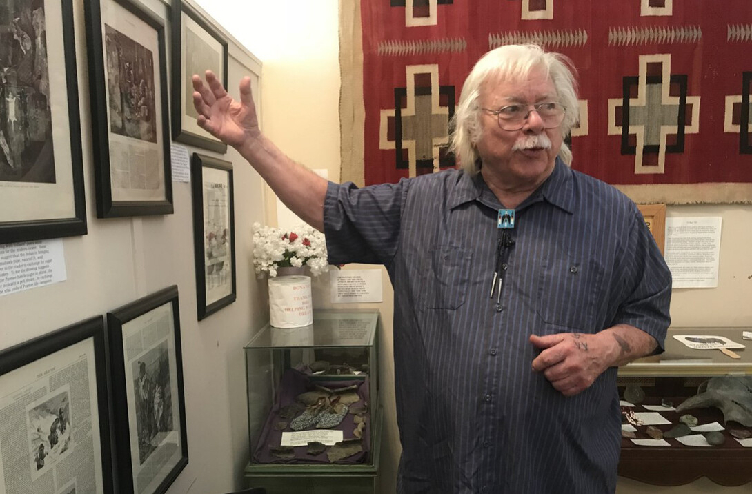 Roger Welsch shows the filmmakers a collection of historical articles and photos about the Pawnee Nation in Dannebrog, Nebraska.