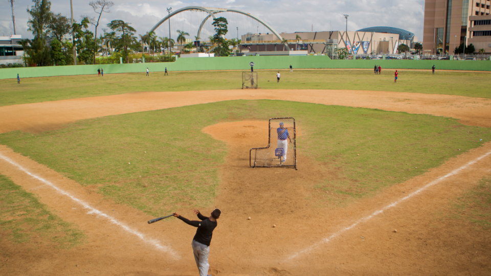 A shortstop takes batting practice at the Centro Olimpico baseball field in Santo Domingo. “Two Wings to Fly: Stories of fear, hope and economics in the Dominican Republic” tells a variety of stories, from sex workers to teen pregnancy; baseball hopefuls to cockfighting; and many more.
