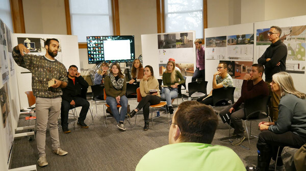 Nebraska architecture students discuss museum design concepts with (right) Diane Walkowiak and Guillermo Yángüez Bergantino.