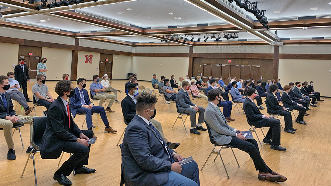 Theta Xi members, shown here earlier in the semester during a fraternal ceremony with social distancing and masks in place, are all getting tested for COVID-19 prior to leaving campus for Thanksgiving.