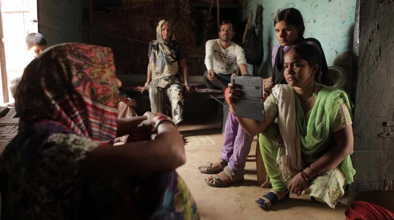 Female journalists in India conduct an interview in a scene from "Writing with Fire," a documentary that opens Jan. 7 at Nebraska's Mary Riepma Ross Media Arts Center.