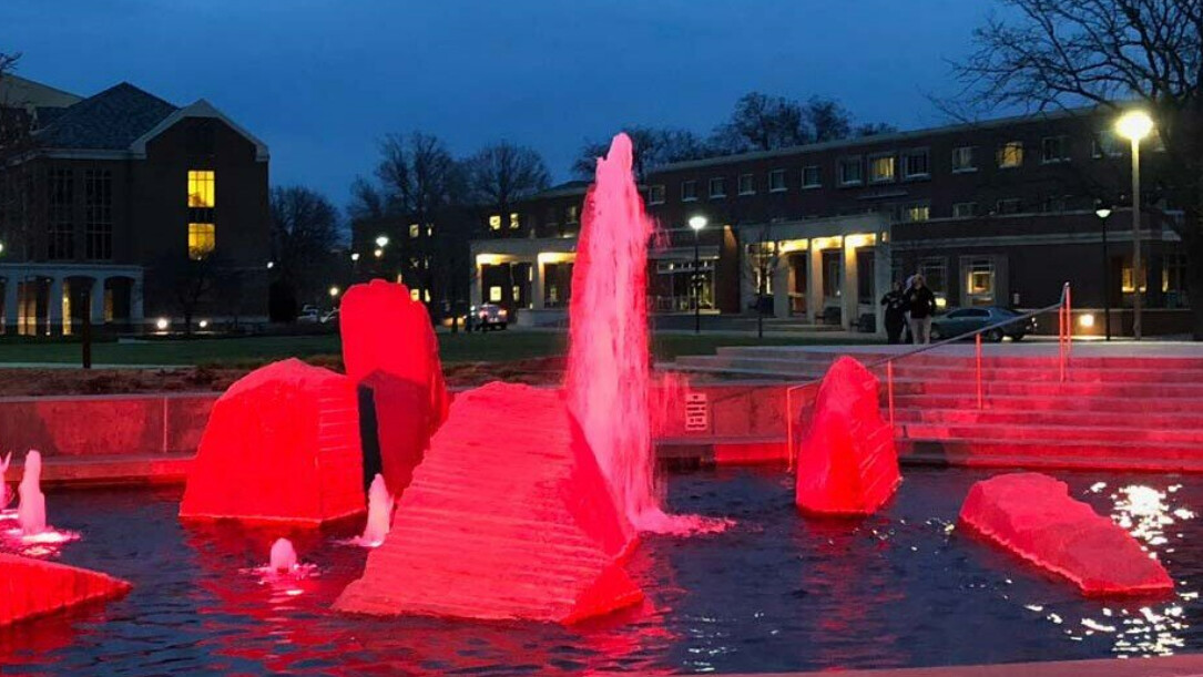 Lights illuminate the Broyhill Fountain red in honor of late UNL student, Keaton Klein.