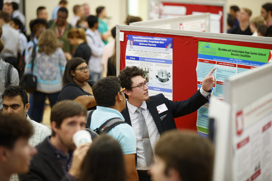 Student presenting research at the Nebraska Summer Research Symposium