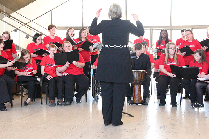 Rhonda Fuelberth, associate professor, directs the i2Choir in a performance at Sheldon Museum of Art.