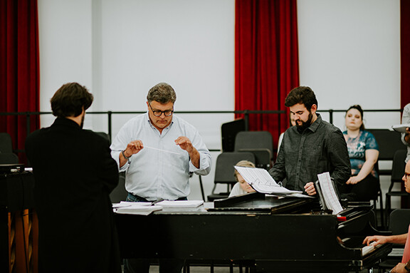 Tyler White (center) rehearses with Patrick McNally (left) and Matthew Gerhold. The Glenn Korff School of Music is premiering a new opera “The Gambler’s Son” by composer Tyler Goodrich White and librettist Laura White. 