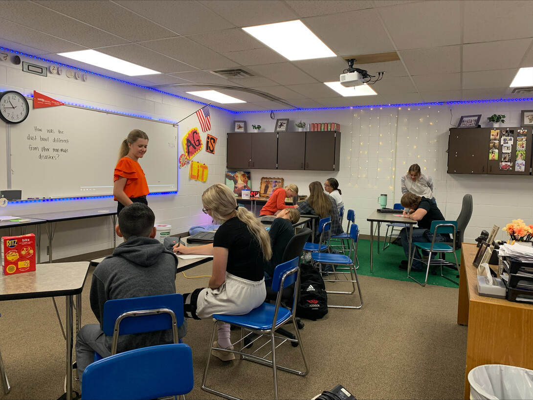 Students sit in a classroom