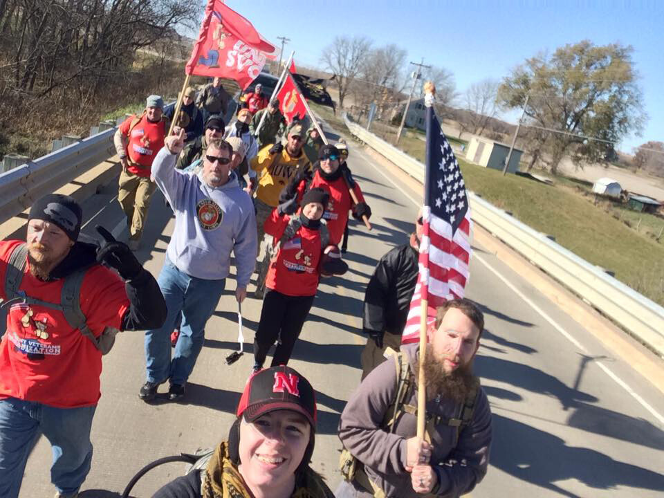 Team Nebraska marches along a highway on its way to Iowa City. More than 200 volunteers are helping with the march.