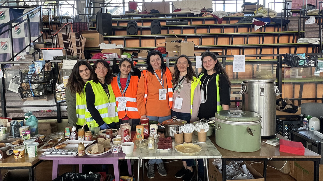 To ease nerves of the refugees, volunteers made certain food was ready at all times. Nebraska's Tatyana Gulchuk (left) and other volunteers are shown here at a food station within an athletic facility that was converted into a refugee center.