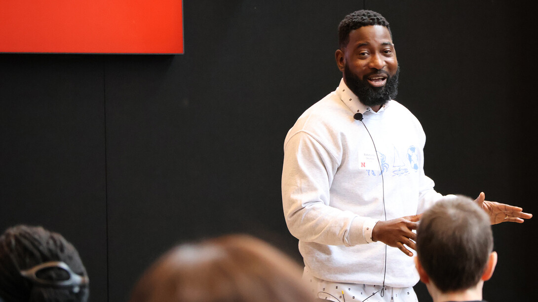 Babatunde Okunlola, a graduate student in journalism and mass communications, presents on stage during the Student Research Days Slam at the University of Nebraska–Lincoln on April 9.